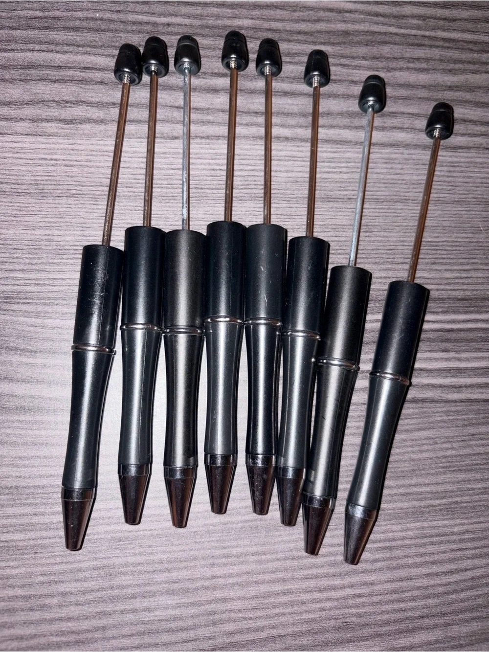 8 black blank pens